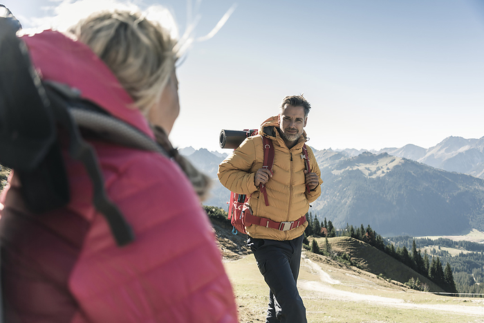 Austria, Tyrol, man with woman hiking in the mountains