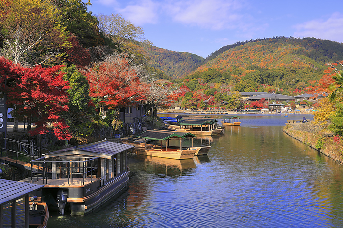 Houseboat cruising the autumn leaves of Arashiyama and the Katsura River, Kyoto 100 Best Places to View Autumn Foliage in Japan