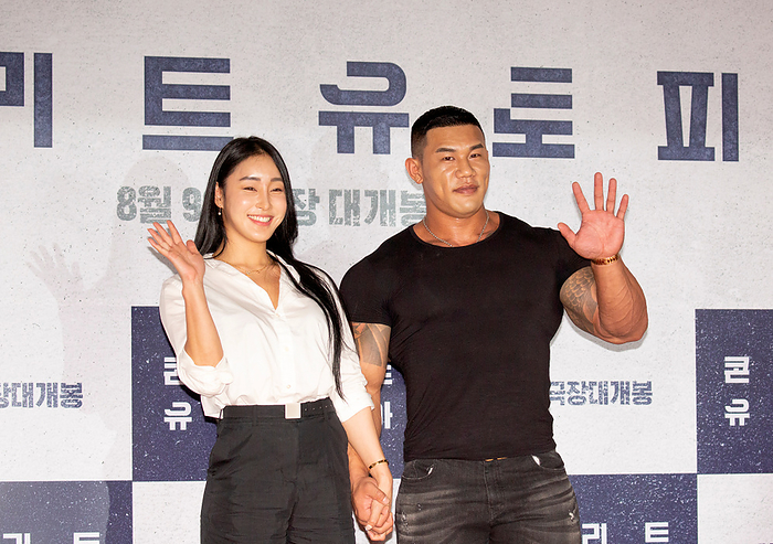 A VIP preview of Korean movie  Concrete Utopia  in Seoul Song A Reum and Kim Kang Min, Aug 8, 2023 : Bodybuilder couple Song A Reum  L  and Kim Kang Min pose at a photo call before the VIP preview of South Korean movie  Concrete Utopia  at a theatre in Seoul, South Korea. The disaster thriller  Concrete Utopia  revolves around the residents of the only apartment building that survived a catastrophic earthquake in Seoul.  Photo by Lee Jae Won AFLO   SOUTH KOREA 