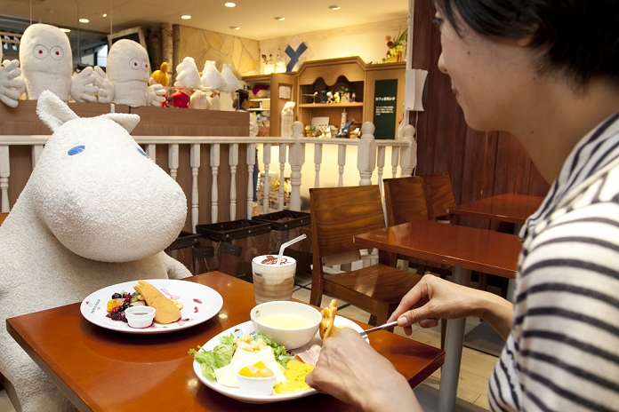 Enter the World of the Fairy Tale  Moomin Theme Cafe in Tokyo Tokyo, Japan   A woman enjoys breakfast with a huge plush Moomin character at the Moomin House Cafe in TOKYO SKYTREE on June 17, 2014. There are three Moomin Cafe in Japan, serving food and desserts in the form of the Finnish character. This year is the 100th anniversary of the birth of their creator Tove Jansson  1914   2001 .  C  Moomin CharactersTM.  Photo by Rodrigo Reyes Marin AFLO 