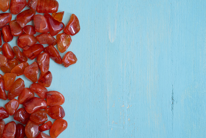 Red natural stone on blue background