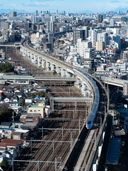 Hokuriku Shinkansen Series E7 and W7 running near Kita-ku, Tokyo View from Kita-topia