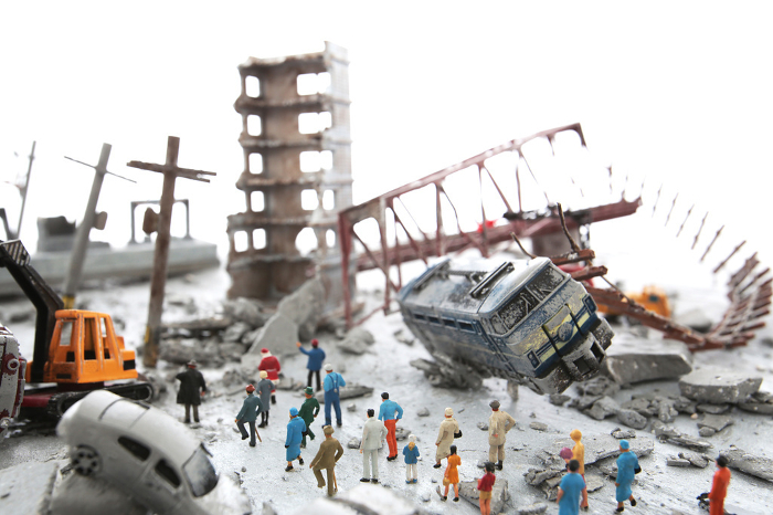 Diorama scenery of a city destroyed by disaster or war and wandering people