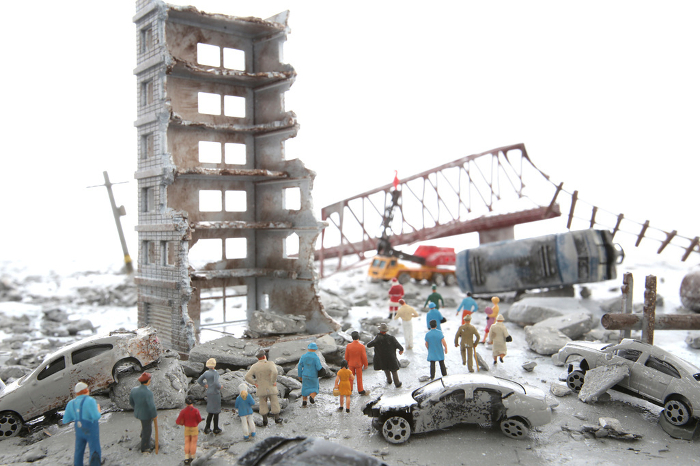 Diorama scenery of a city destroyed by disaster or war and wandering people
