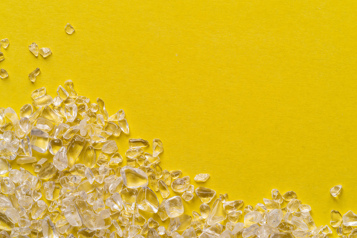 Scattered crystals on yellow background