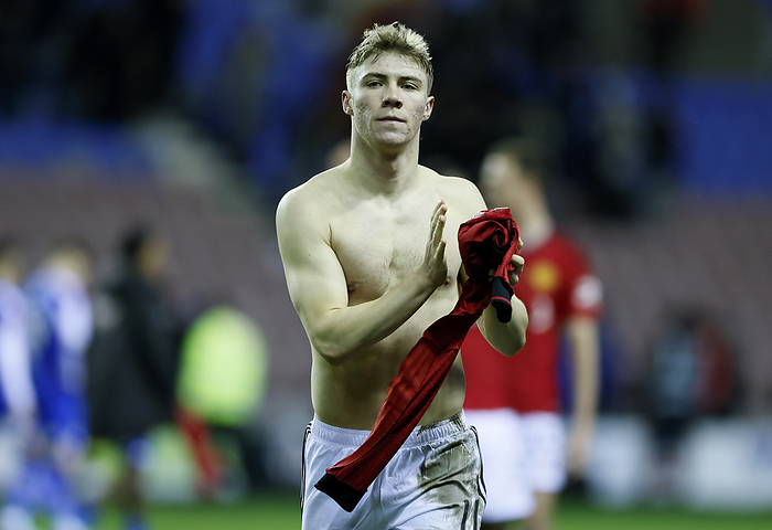 Wigan Athletic v Manchester United    Emirates FA Cup Third Round Rasmus Hojlund of Manchester United celebrates with his shirt removed after the Emirates FA Cup Third Round match between Wigan Athletic and Manchester United at DW Stadium on January 8, 2024 in Wigan, England.   WARNING  This Photograph May Only Be Used For Newspaper And Or Magazine Editorial Purposes. May Not Be Used For Publications Involving 1 player, 1 Club Or 1 Competition Without Written Authorisation From Football DataCo Ltd. For Any Queries, Please Contact Football DataCo Ltd on  44  0  207 864 9121
