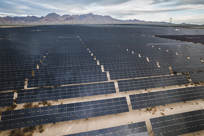 large industrial sized solar farm in the Nevada desert, by Cavan Images / Chris Bennett