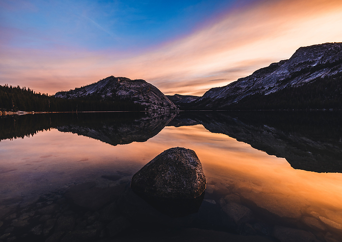 Colorful sunrise reflected in Tenaya Lake Yosemite Park California, by Cavan Images / Chris Bennett