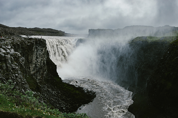 Huge waterfall and river in massive canyon with mist, by Cavan Images / Anna Rasmussen Photographs