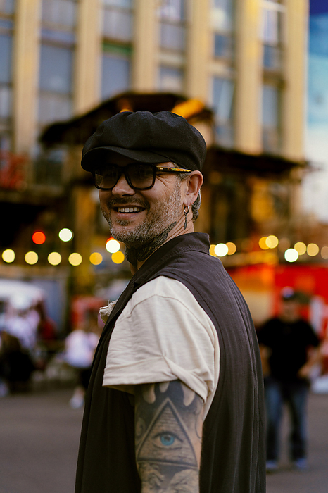 Stylish tattooed man. Urban lifestyle., by Cavan Images / Yuliya Kirayonak