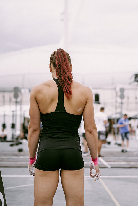 Women's CrossFit competition. Young woman crossfit athlete., by Cavan Images / Yuliya Kirayonak