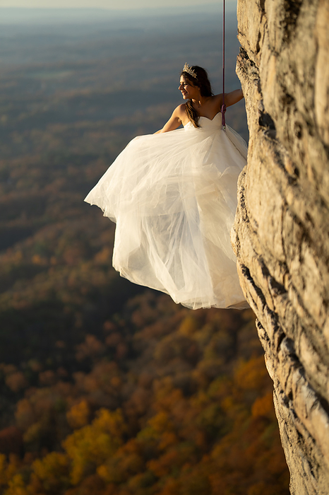 Rock Climbing Wedding Bride at Sunrise, by Cavan Images / Vultaggio Studios