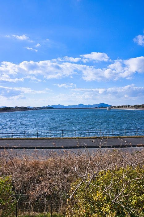 Manba Regulating Pond with whitecaps of the Toyokawa River water supply in Toyohashi City, Aichi Prefecture, Japan.