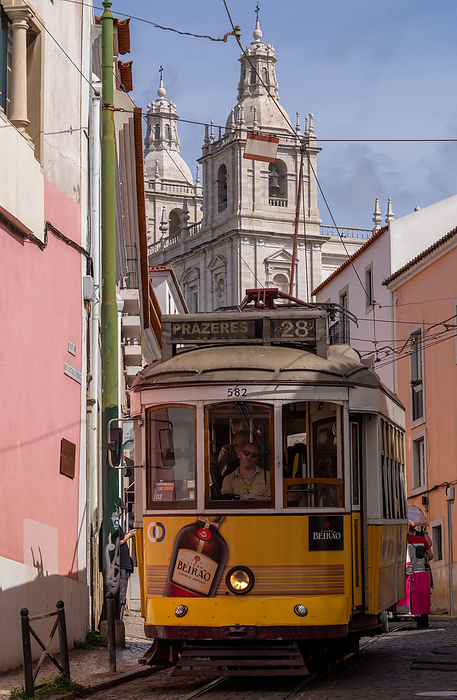 Trams and tourist buggies in the Alfama old town area of Lisbon, Portugal, Europe Trams and tourist buggies in the Alfama old town area of Lisbon, Portugal, Europe, by Julio Etchart