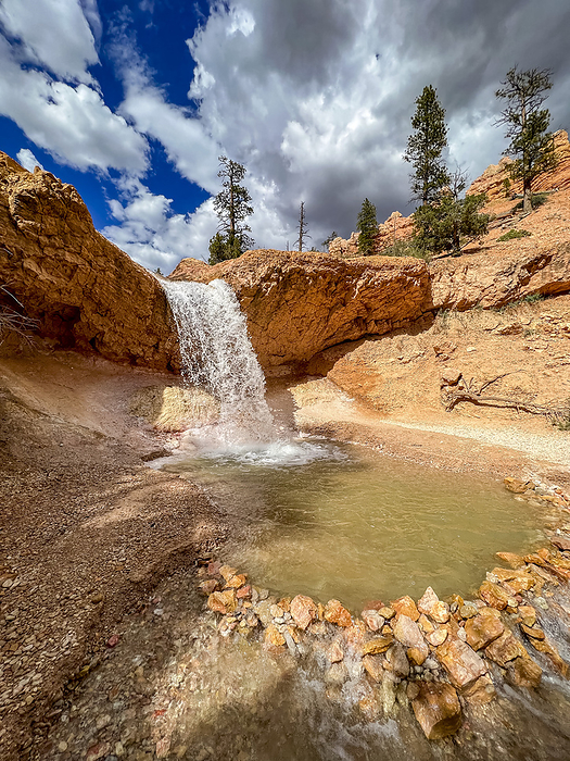 A waterfall running through the Mossy Cave Trail in Bryce Canyon National Park, Utah, United States of America, North America A waterfall running through the Mossy Cave Trail in Bryce Canyon National Park, Utah, United States of America, North America, by Michael Nolan