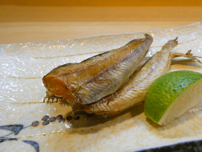 A photo of seared, dried fish under ice, a winter delicacy of Hokkaido.