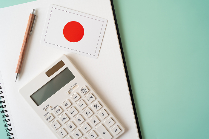 Japanese flag, calculator, notebook, pen