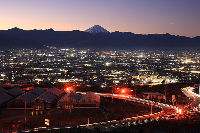 Fuji and the Kofu Basin at dawn as seen from Fuefukigawa Fruit Park, Yamanashi Prefecture