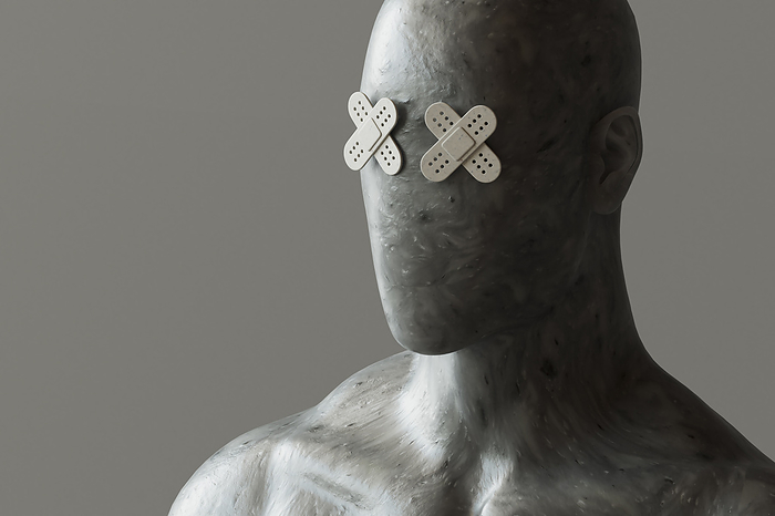 Face of mannequin with band aid eyes against gray background