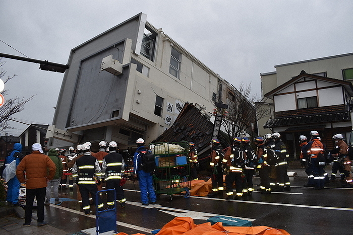 Major Earthquake of Magnitude 7 in Noto District, Wajima City, Ishikawa Prefecture Firefighters rescue a person trapped under a collapsed building in Wajima, Ishikawa Prefecture, Japan, at 1:55 p.m. on January 3, 2024.