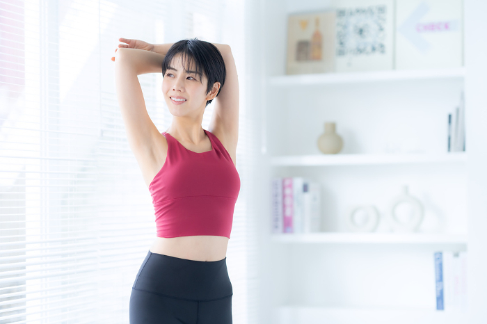 Young Japanese woman exercising (People)