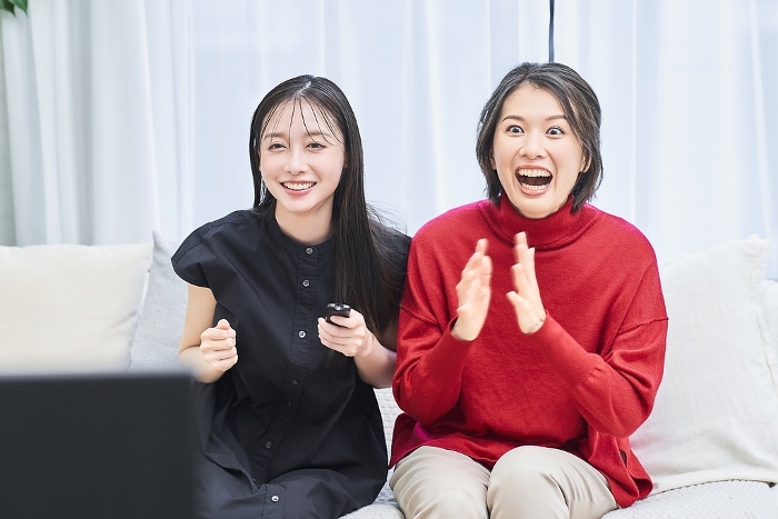 Japanese women watching the game on TV (People)
