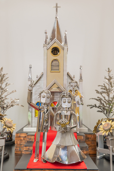 Happy couples get married in church, metal figurine