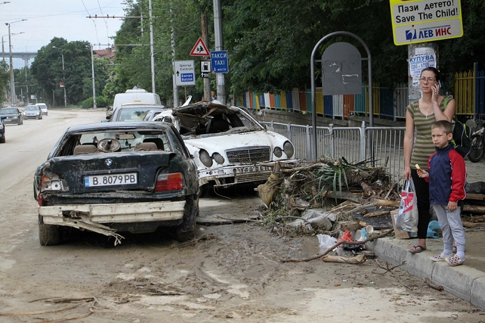 Torrential Rains in Bulgaria Heavy flooding and deaths. People and rescue workers try to save belongings and help another people after a flood and mud hit in the Black sea town of Varna east of the Bulgarian capital Sofia, Saturday, June, 21, 2014. Heavy rains in Bulgaria s Black Sea city of Varna on Thursday afternoon flooded the town, 11 people at last were found dead and 6 people are reported missing.The situation is most serious in the district of Asparuhovo, where, according to reports, the floodwaters obliterated the district and carried along and upturned hundreds of cars.According to the city councillor Radoslav Koev. Asparuhovo was hit by a flash flood from the ridge above the district. The water flooded homes and public buildings, there are streets and homes swamped in mud.  Most likely there are drowned people,  Koev said.The city boulevards and streets are turned into rivers and the pedestrian underpasses are completely flooded. Due to the electrical storm, entire sections of Varna have no electricity, landlines and cell phones in certain areas are out of order. The public transport is also seriously disrupted.Photo by: Petar Petrov Impact Press Group 