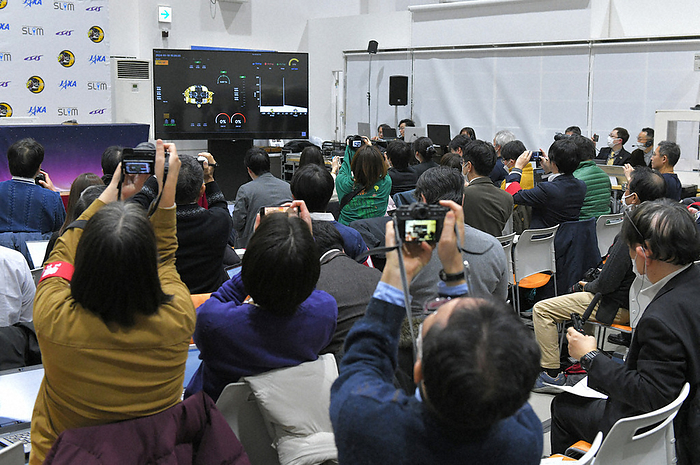 JAXA s Unmanned Spacecraft SLIM: World s Fifth Country to Land on the Moon A large number of media representatives point their cameras at the SLIM telemetry image projected on the screen as JAXA s Small Lunar Demonstrator  SLIM  is on the verge of landing on the Moon.