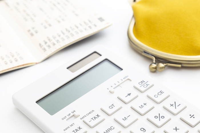 Calculator, wallet and bankbook