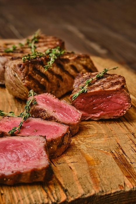 Closeup view of medium rare beef steak, prime strip loin meat