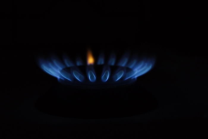 Blue gas flame on a hob, gas cooker, close up