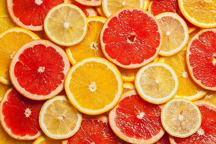 Colorful citrus fruit, lemon, orange, grapefruit, slices background