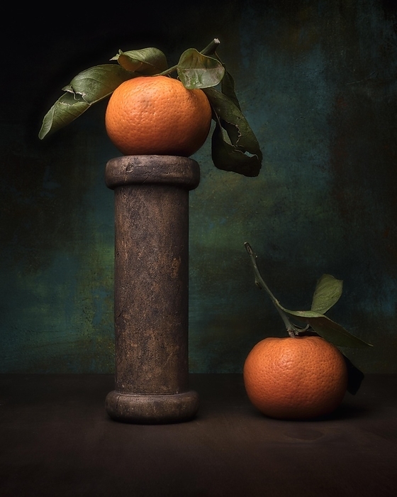 Food photography, still life with mandarins on old wooden spool, studio shot, symbol photo