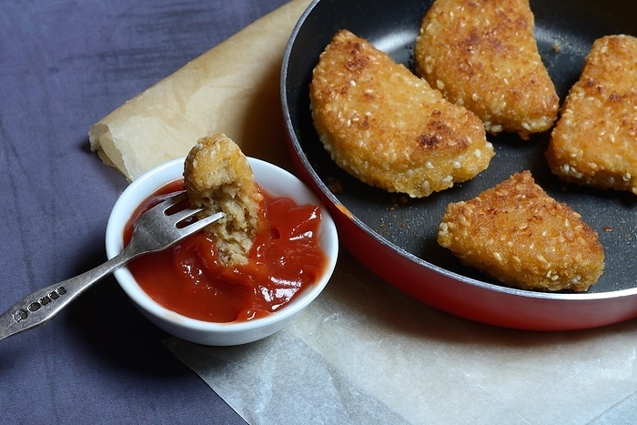 Meat substitute in pan and bowl with ketchup, imitation meat, nugget, Germany, Europe