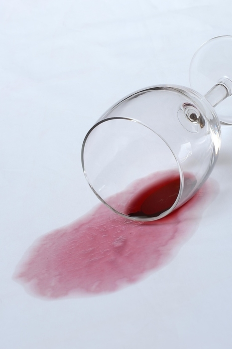 Red wine stain, overturned red wine glass on fabric, stain