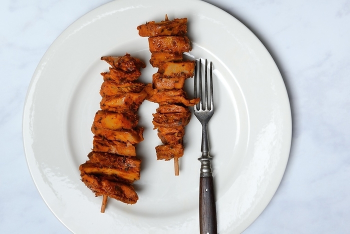 Meat substitute, barbecue skewer on plate with fork