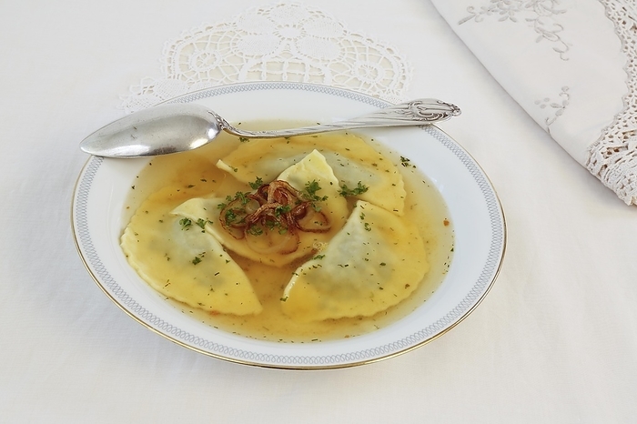 Swabian cuisine, Maultaschen in broth with stewed onion rings, soup plate, spoon, Germany, Europe