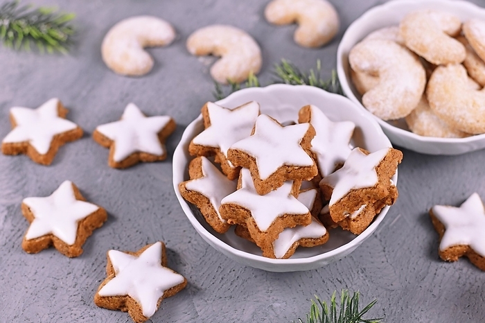Bowl with traditional German cinnamon star Christmas cookies called 'Zimtsterne' made with almonds, egg white, sugar, cinnamon and flour
