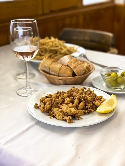 Fried small squid with lemon and white bread, Majorca, Puerto Andratx, Majorca, Spain, Europe