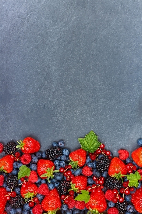 Berries Fruits Berry Fruit Strawberries Strawberry Blueberries Blueberry with text free space Copyspace on slate, Germany, Europe