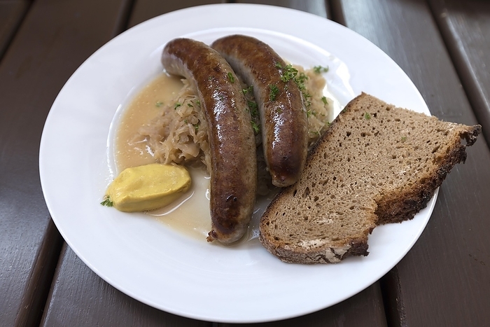 Franconian sausages with sauerkraut and bread served in a beer garden, Franconia, Bavaria, Germany, Europe