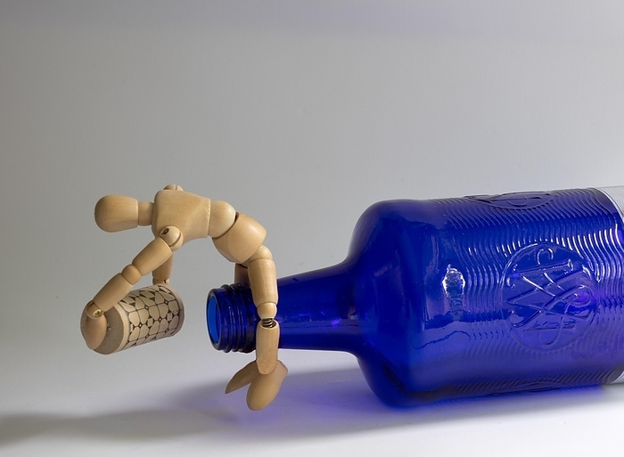 Still life, symbol photo work, wooden figure with blue bottle and cork, Germany, Europe