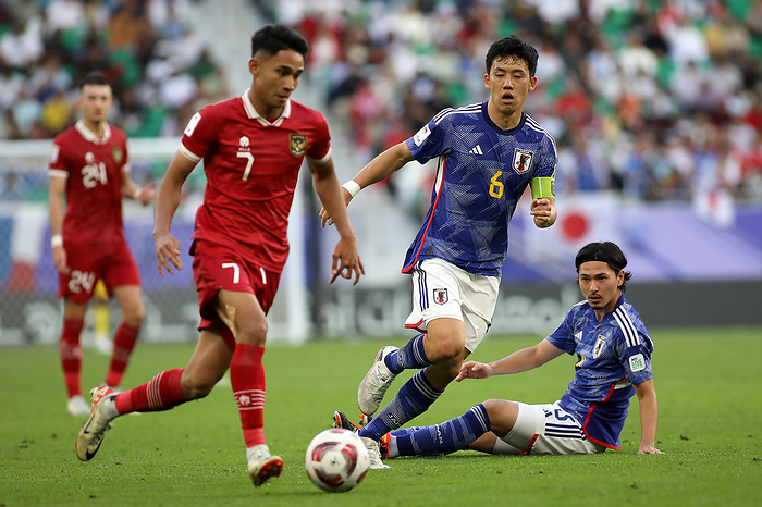 Japan v Indonesia: Group D   AFC Asian Cup DOHA, QATAR   JANUARY 24: Marselino Ferdinan of Indonesia L  and Wataru End   captain  of Japan R  during the AFC Asian Cup Group D match between Japan and Indonesia at Al Thumama Stadium on January 24, 2024 in Doha, Qatar.  Photo by Colin McPhedran MB Media  