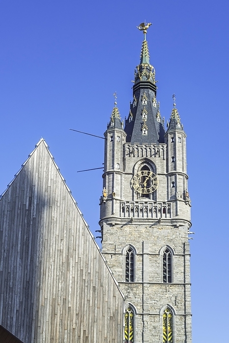 Medieval belfry tower and modern Gentse Stadshal, Ghent Market Hall in the historic city center of Ghent, Gent, East Flanders, Belgium, Europe
