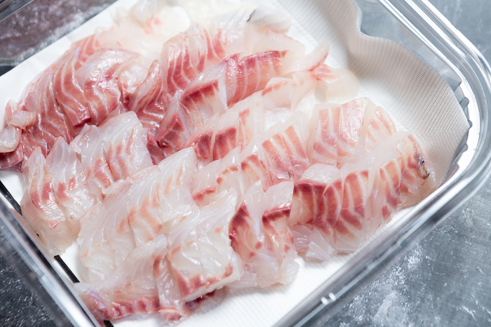 Fresh sashimi in a packaging container