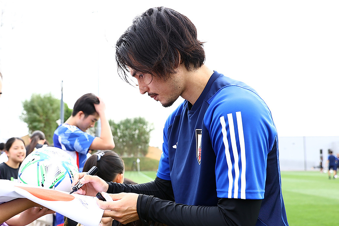 AFC Asian Cup Qatar 2023 Japan training session Japan s Takumi Minamino signs autographs for local kids during a training session in Doha, Qatar, January 27, 2024.  Photo by JFA AFLO 