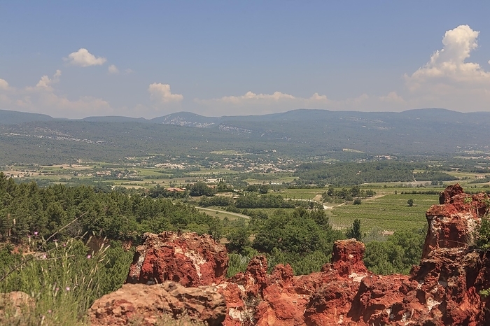 View over the ochre rocks of Roussillon into the landscape of the Luberon, Département Vaucluse, Provence-Alpes-Cote dAzur, France, Europe, by AnnaReinert