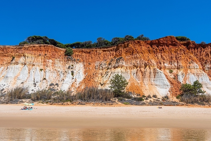 One of the best-known features of the Portuguese Algarve is the cliffs of light yellow, through orange to deep red sandstone. The Portuguese sandy beaches in the Algarve are a popular holiday destination for tourists from all over the world., Algarve, Falesia, Faro, Portugal, Europe, by Florian Gaul