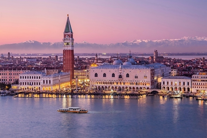 Waterfront with Campanile and Doge's Palace in front of the Alpine chain at dusk, Venice, Veneto, Northern Italy, Italy. UNESCO World Heritage Site, by Günter Gräfenhain